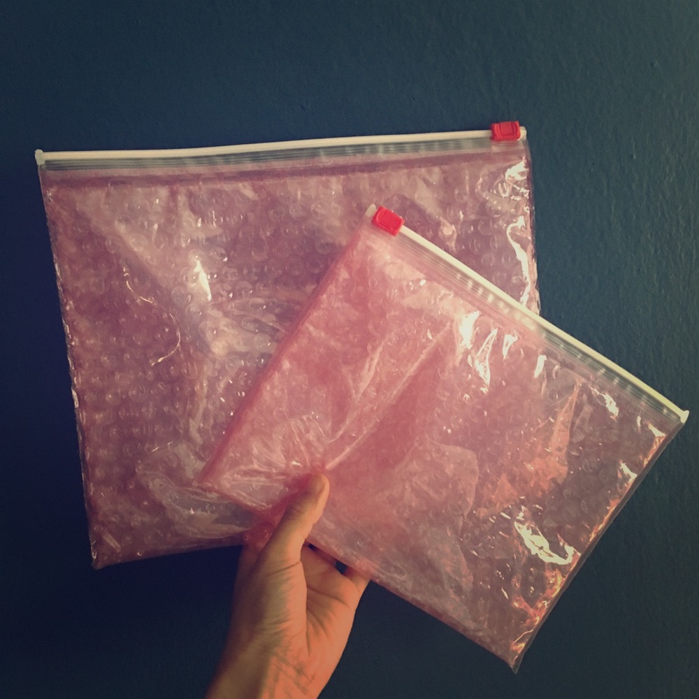Glossier pink pouches